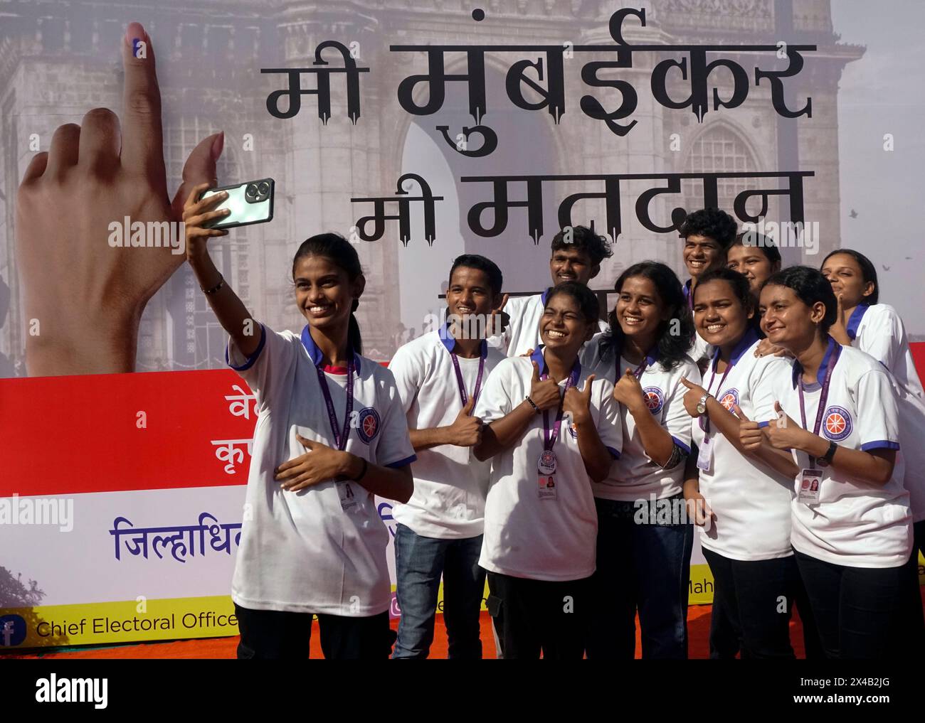 India. 02nd July, 2017. MUMBAI, INDIA - MAY 1: First voter from Mumbai takes selfie photo in front of the Voting awareness poster during the Maharashtra state`s formation day. Maharashtra Governor Ramesh Bais hoisted the National flag at the ceremonial Parade celebrating the 65 state`s formation (Maharashtra Day) at Shivaji Park, Dadar on May 1, 2024 in Mumbai, India. (Photo by Raju Shinde/Hindustan Times/Sipa USA) Credit: Sipa USA/Alamy Live News Stock Photo